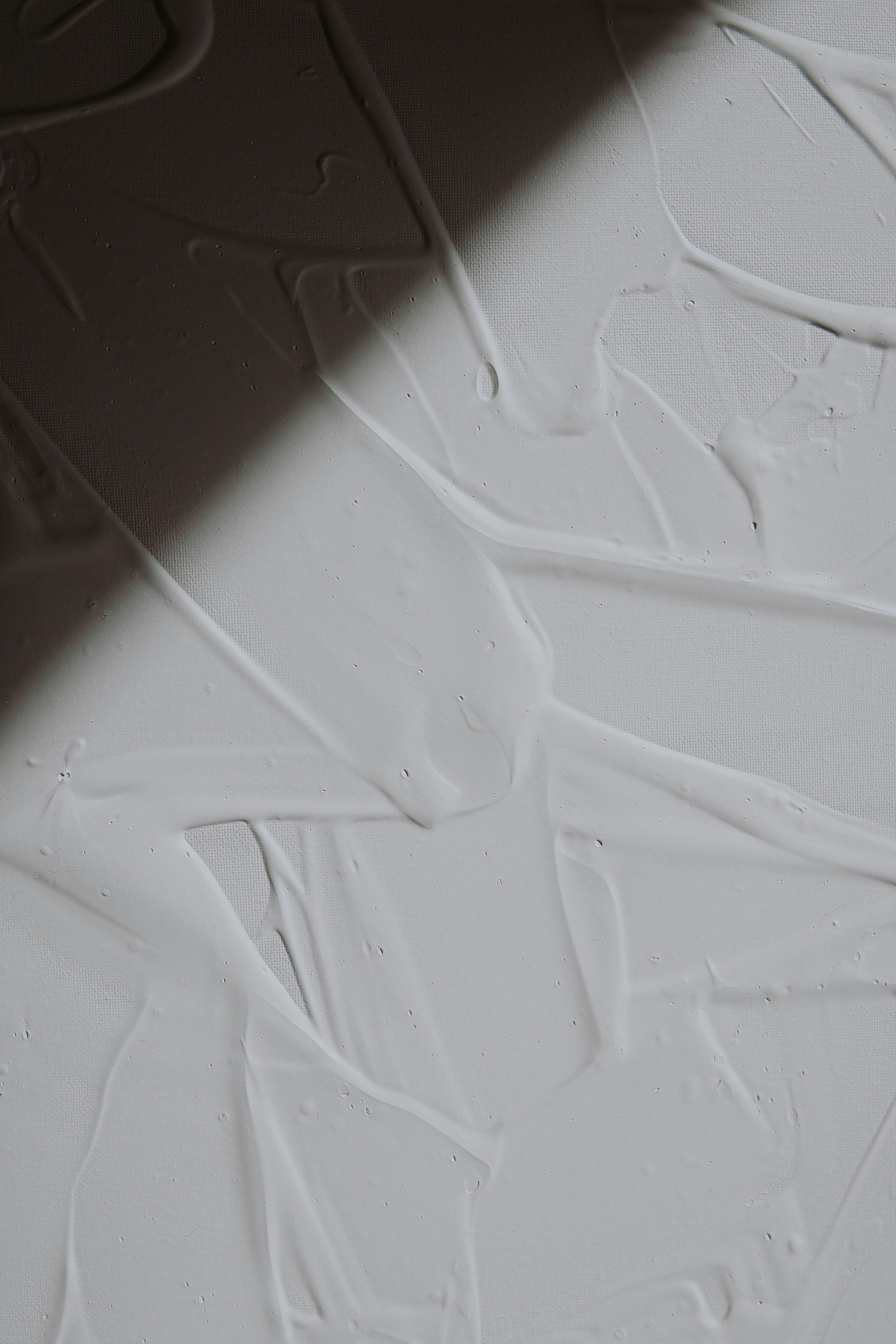 white textile on brown wooden table